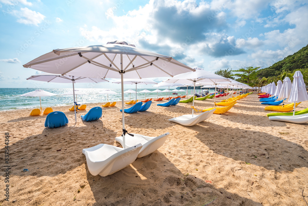 Row of Colorful Sunbathing Chairs on the Sao Beach of Phu Quoc Island, Vietnam, a Tourism Destination for Summer Vacation in Southeast Asia, with Tropical Climate and Beautiful Landscape.