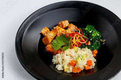 roast chicken fillet in Japanese sake-based sauce, white rice fried with spices, juicy vegetables with broccoli