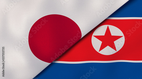 The flags of Japan and North Korea. News, reportage, business background. 3d illustration
