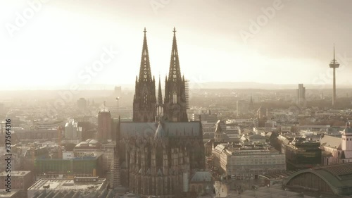 AERIAL: Towards Cologne Cathedral and TV Tower in beautiful hazy Sunlight with Rain  photo