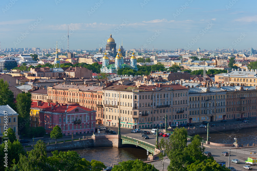 View of the Fontanka river, the Egyptian bridge and the Cathedrals of St. Petersburg.