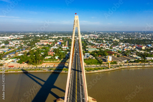 Aerial view of Rach Mieu Bridge, cable-stayed bridge connecting the provinces of Tien Giang and Ben Tre, Vietnam. Famous beautiful bridge of Mekong Delta.   photo