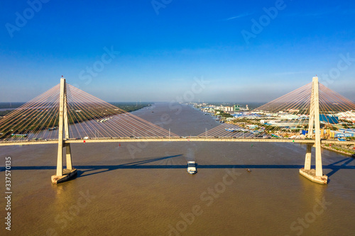 Aerial view of Rach Mieu Bridge, cable-stayed bridge connecting the provinces of Tien Giang and Ben Tre, Vietnam. Famous beautiful bridge of Mekong Delta.   photo