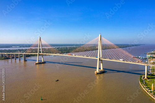 Aerial view of Rach Mieu Bridge, cable-stayed bridge connecting the provinces of Tien Giang and Ben Tre, Vietnam. Famous beautiful bridge of Mekong Delta. 