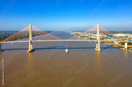 Aerial view of Rach Mieu Bridge, cable-stayed bridge connecting the provinces of Tien Giang and Ben Tre, Vietnam. Famous beautiful bridge of Mekong Delta.   photo