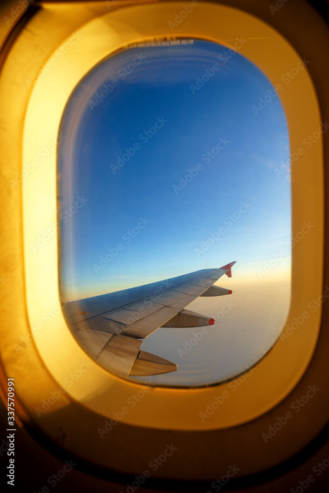 Clouds and sky as seen through window of an aircraft, Vietnam Clouds and sky as seen through window of an aircraft, Vietnam