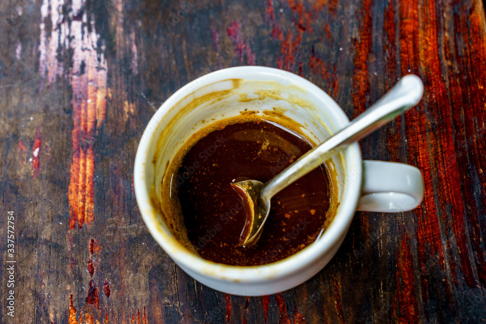 Top view a cup of Giang egg coffee on wood background. Vietnamese coffee in Ha Noi, Vietnam. Eggs are beaten with coffee, hot drink or with ice Top view a cup of Giang egg coffee on wood background. Vietnamese coffee in Ha Noi, Vietnam. Eggs are beaten with coffee, hot drink or with ice