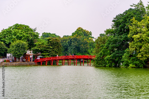 The Huc bridge (red bridge), entrance of Ngoc Son temple on Hoan Kiem lake, Hanoi, Vietnam photo