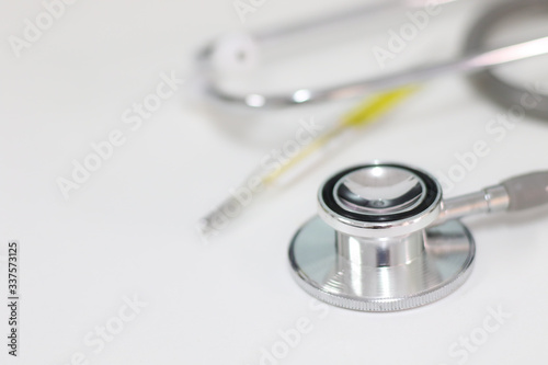Stethoscope isolated equipment on white texture with blurred background