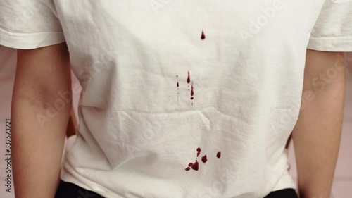 Wallpaper Mural Dropping blood from up to down on white T-shirt, murderer torturing his victim slowly, pain and suffering. Killer showing aggression against person, discrimination and tyranny. Fighting between man Torontodigital.ca