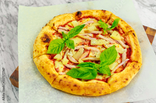 Italian pizza with mozzarella and basil