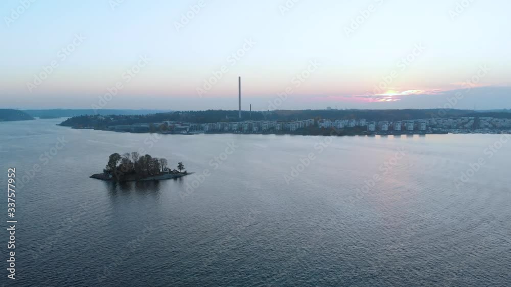 Aerial shot crane camera goes down on archipelago with lush green fields forest in background Aerial shot crane camera goes down on archipelago with lush green fields forest in background