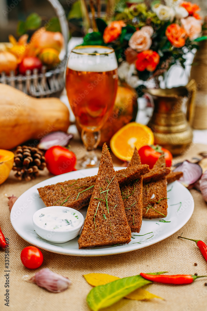 Autumn table setting with pumpkins. Thanksgiving dinner. garlic bread with sauce and herbs