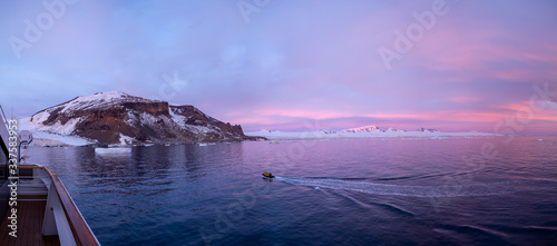 Konstfotografi inflatable boat on the water, sunrise, Brown Bluff, Antarctic Peninsula