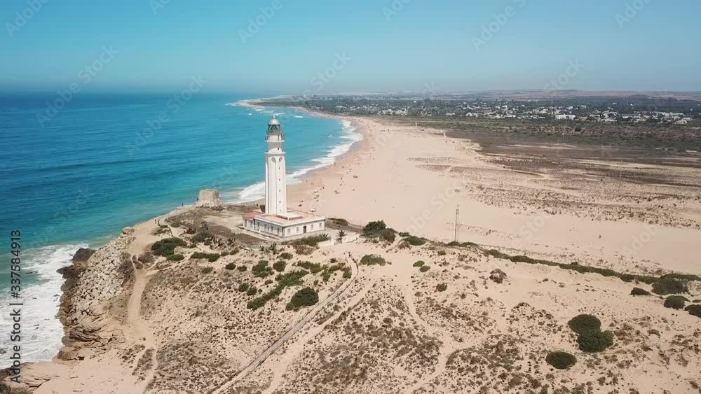 Aerial view of Cape Trafalgar, drone having point of interest the lighthouse,  Cadiz, Spain. Atlantic Ocean, northwest of the Strait of Gibraltar. In 1805 naval Battle of Trafalgar took place here.