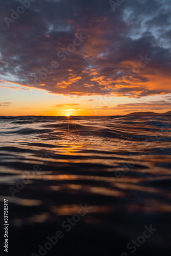 View of stormy clouds over sea during sunset © Jeremy Bishop