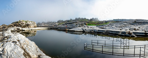 Secure ramp access and stairs with steel fence at Sjobadet Myklebust swimming sea area, Tananger, Norway, May 2018 photo