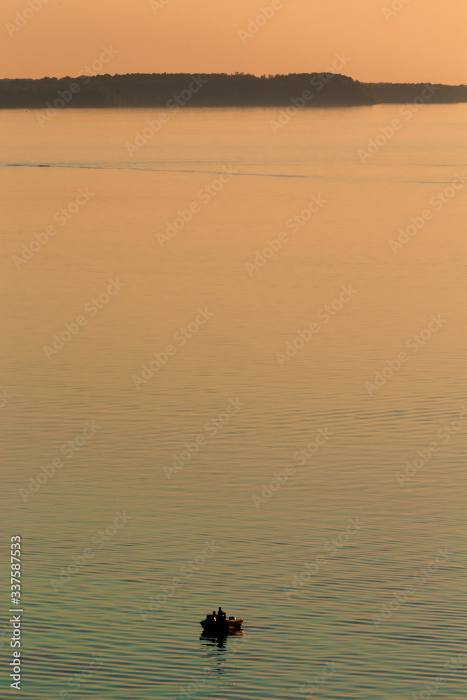 fishing boat on the lake at sunset fishing boat on the lake at sunset