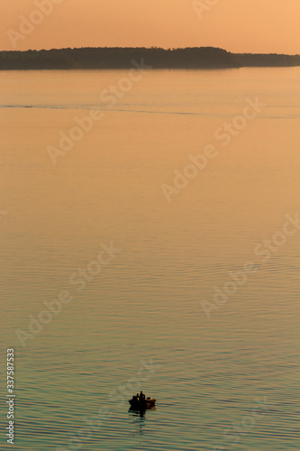 fishing boat on the lake at sunset © Tyler