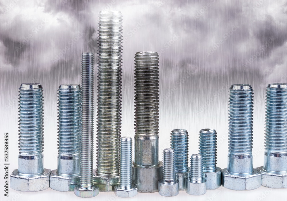 Bolts standing like a skyline in the rain. City made with bolts Bolts standing like a skyline in the rain. City made with bolts