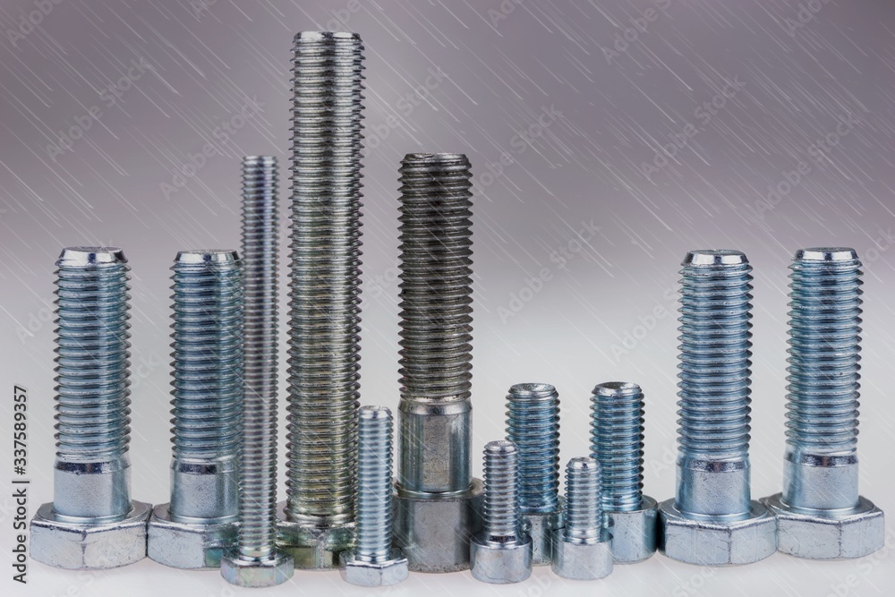 Bolts standing like a skyline in the rain. City made with bolts Bolts standing like a skyline in the rain. City made with bolts