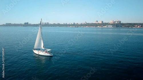 Yacht sailing on opened sea. Sailing boat. Yacht from drone. Yachting video. Yacht from above. Sailboat from drone. Sailing video. Yachting at windy day. Yacht. Sailboat.