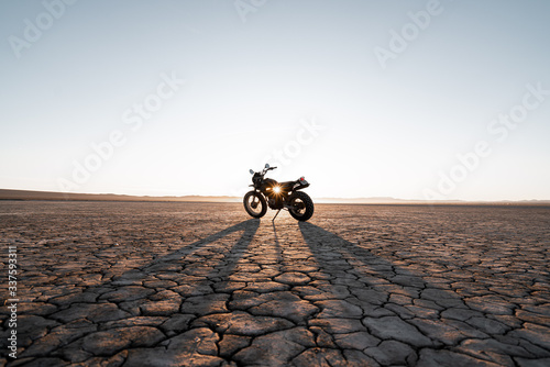 Motorcycle parked in Death Valley during sunset