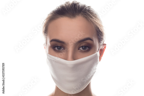Woman wearing face protective mask on face against Coronavirus.