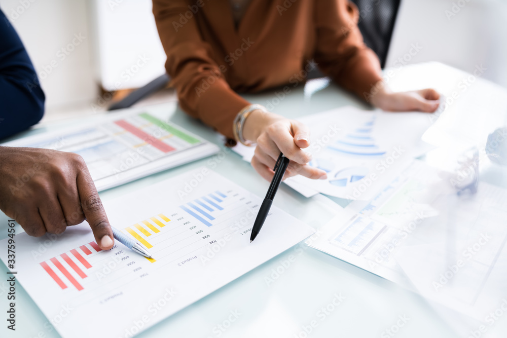 Businesswoman Writing On Graph Businesswoman Writing On Graph