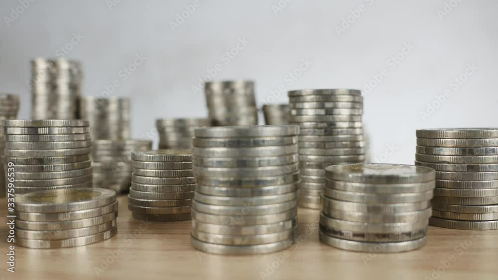 Coins stack, real estate, and bank saving concepts Coins stack, real estate, and bank saving concepts