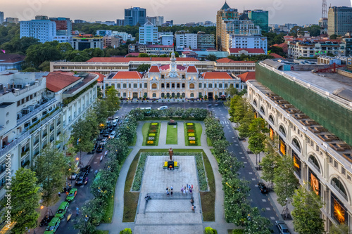 Aerial panoramic cityscape view of HoChiMinh City People's Committee and Nguyen Hue Walking Street , Vietnam with blue sky at sunset. 