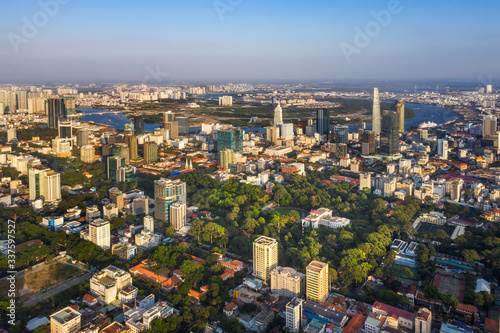 Aerial panoramic cityscape view of Independence Palace or Reunification Palace and center Ho Chi Minh City, Vietnam with blue sky at sunset. 