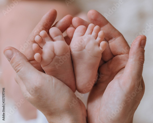 parent is holding little baby feet