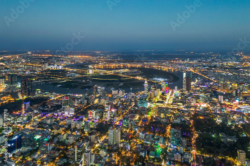 Top view aerial photo from flying drone of a Ho Chi Minh City with development buildings  transportation  energy power infrastructure. Financial and business centers in developed Vietnam.