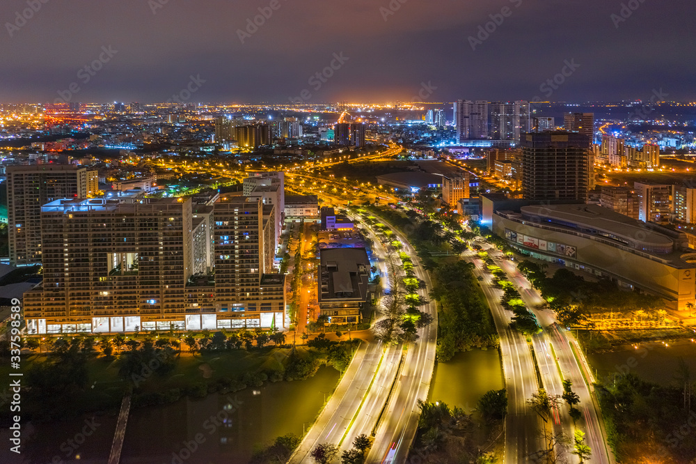 Top view aerial of Nguyen Van Linh road, area Phu My Hung new urban, Ho Chi Minh City with development buildings, transportation, energy power infrastructure. Financial  in developed Vietnam. 