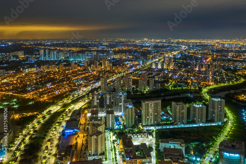 Top view aerial of Nguyen Van Linh road, area Phu My Hung new urban, Ho Chi Minh City with development buildings, transportation, energy power infrastructure. Financial  in developed Vietnam.  © Hien Phung