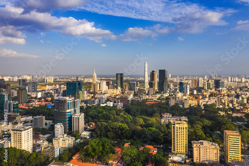 Top view aerial photo from flying drone of a Ho Chi Minh City with development buildings, transportation, energy power infrastructure. Financial and business centers in developed Vietnam.