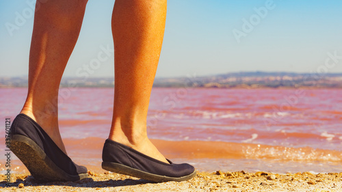 Woman on pink lake in Spain