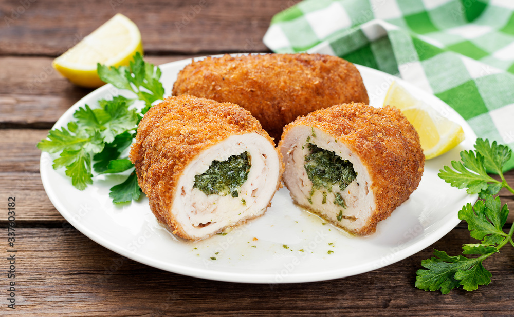 Breaded Chicken Kiev breast stuffed with butter, garlic and herbs. Breaded Chicken Kiev breast stuffed with butter, garlic and herbs.
