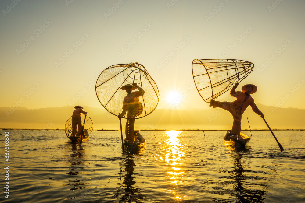 Myanmar travel attraction landmark - Traditional Burmese fishermen with ...