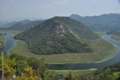 Rijeka Crnojevi  a  part of the Skadar Lake in Montenegro. Tourist cruises by boat on the beautiful meanders of the river flowing between the hills.