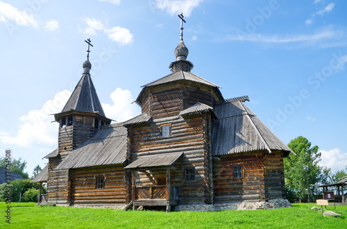 Suzdal, Russia - July 26, 2019: Museum of wooden architecture and peasant life. Resurrection Church from the village of Patakino Kameshkovsky district (1776).  Golden ring of Russia  photo