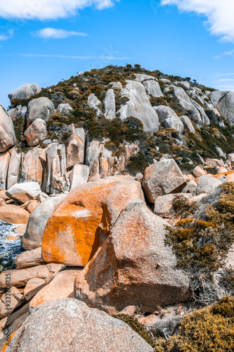 Enormous orange boulders at Tongue Point trek in Wilsons Prom National Park, Australia photo