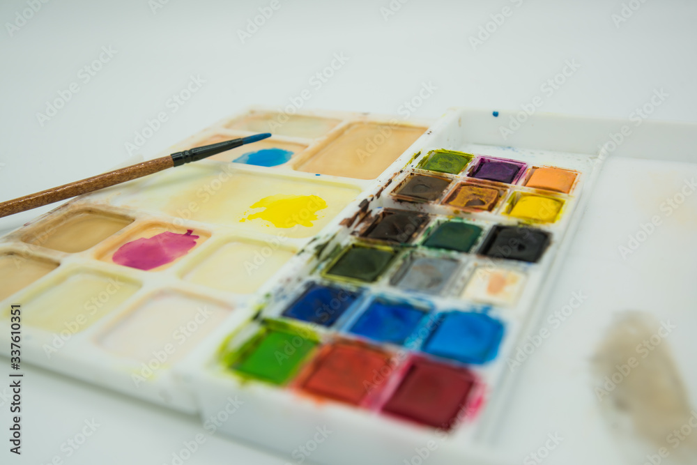 Close up photography of watercolor palette and a brush. Close up photography of watercolor palette and a brush.
