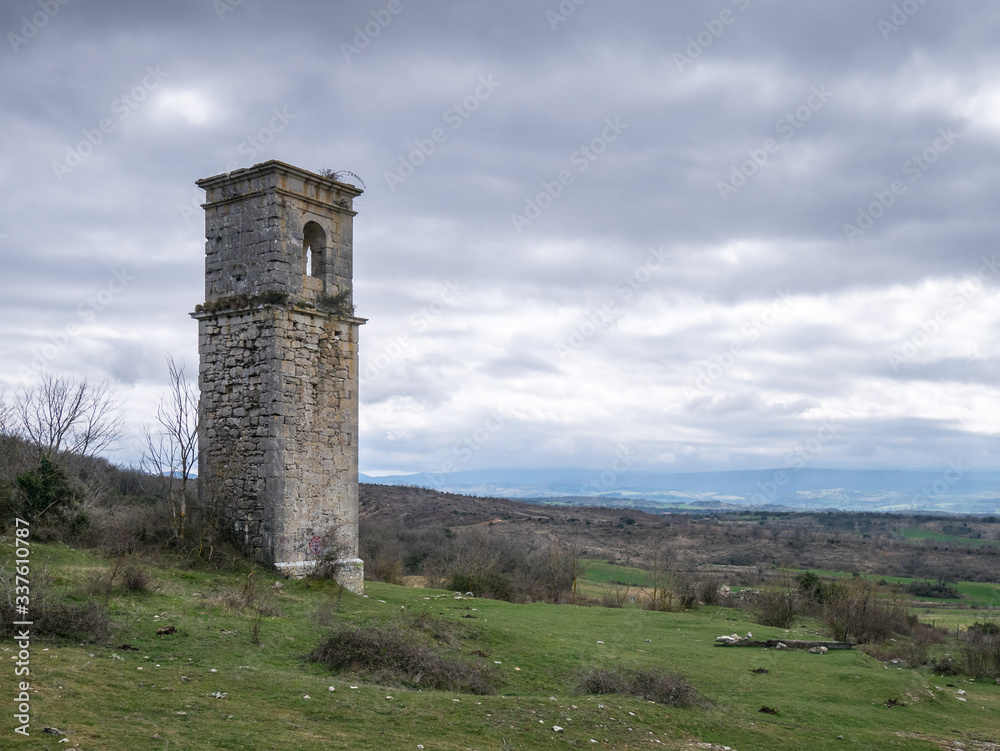 Old church tower of the abandonded haunted village of Ochate, Trevino Country, Burgos, Spain