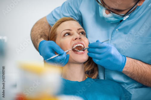Portrait of female patient having treatment at dentist