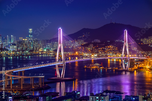 Busan harbor bridge lits up at night in different colors. Taken in Busan, South Korea