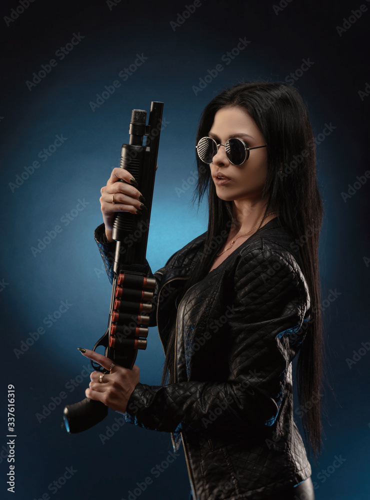 girl in a leather jacket with a shotgun girl in a leather jacket with a shotgun