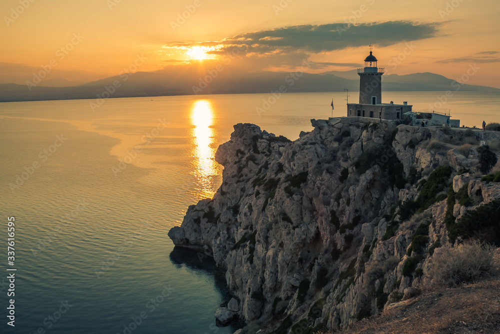 Lighthouse Melagavi at sunset in Loutraki Greece near Iraion lake