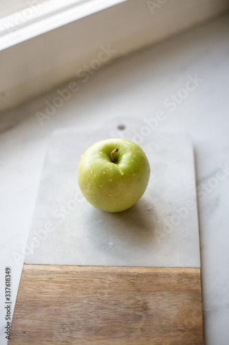 Green Apple on marble background
